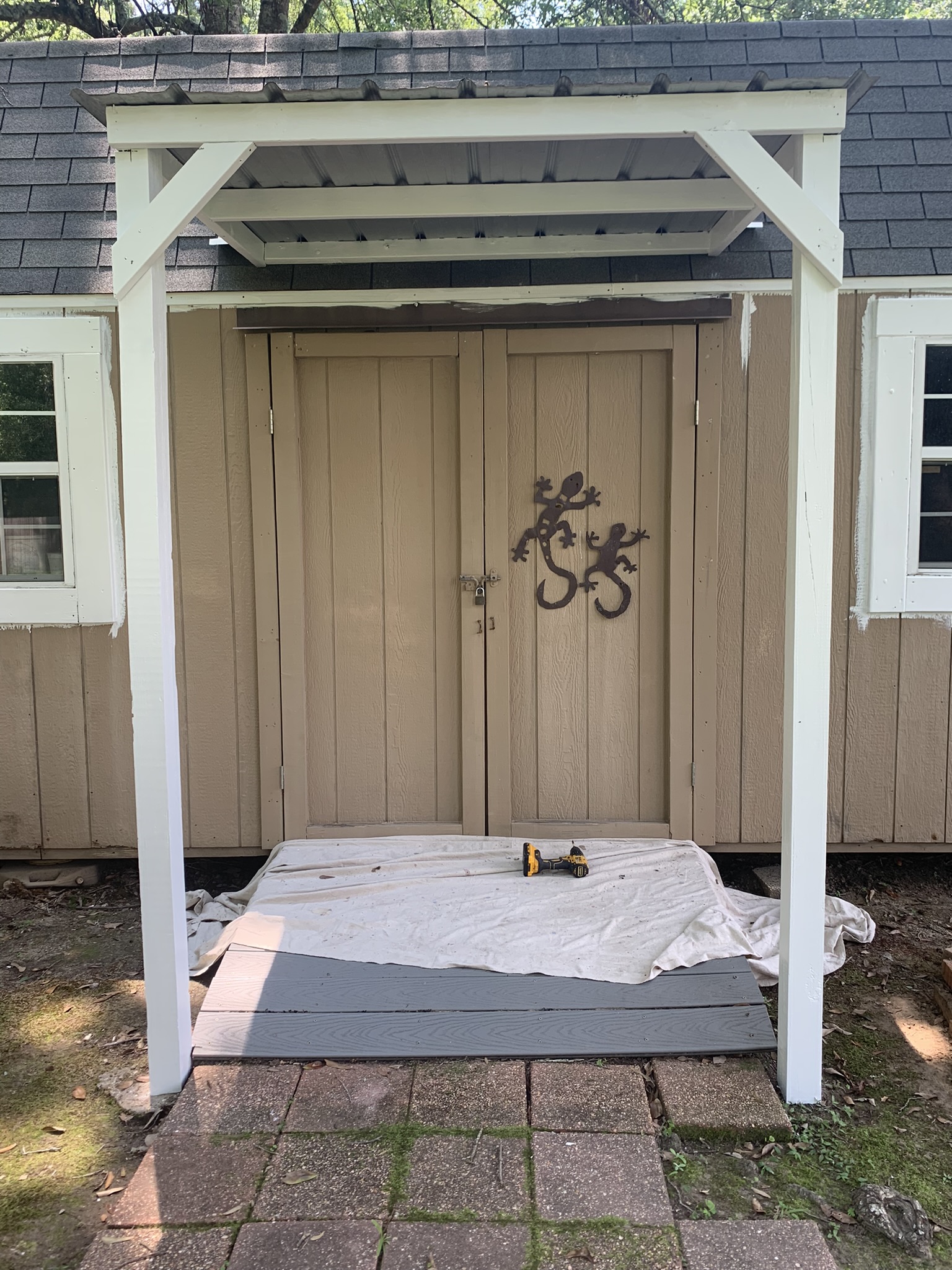 Shed Painted in Kiln MS by local painter Paint Star - brown wooden shed being painted