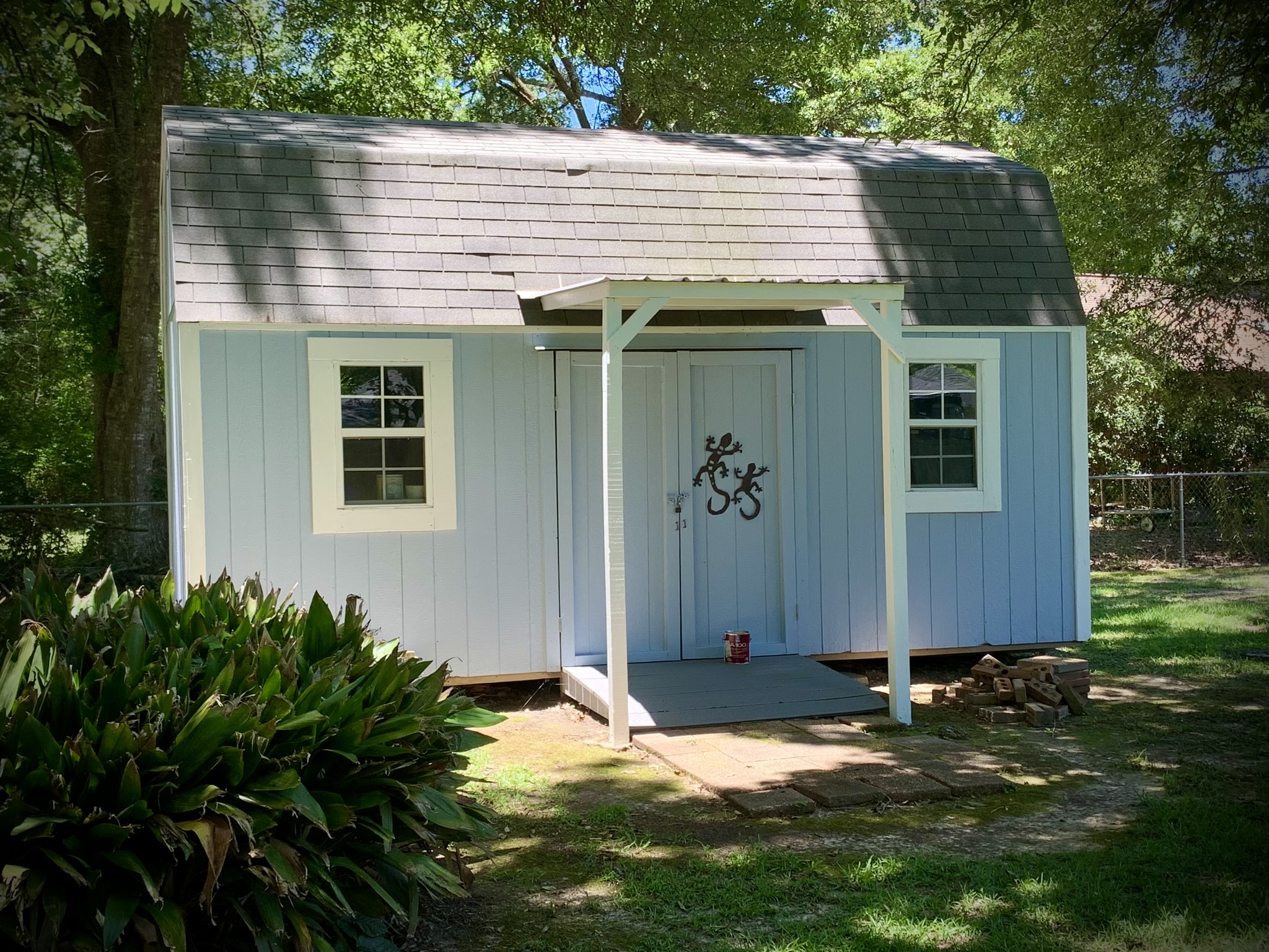 Shed Painted in Kiln MS by local painter Paint Star - blue and white wooden shed freshly painted Sherwin Williams Windy Blue