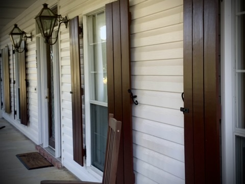 Shutters Painted in Poplarville MS by local painter Paint Star - brown freshly painted satin shutters on southern home