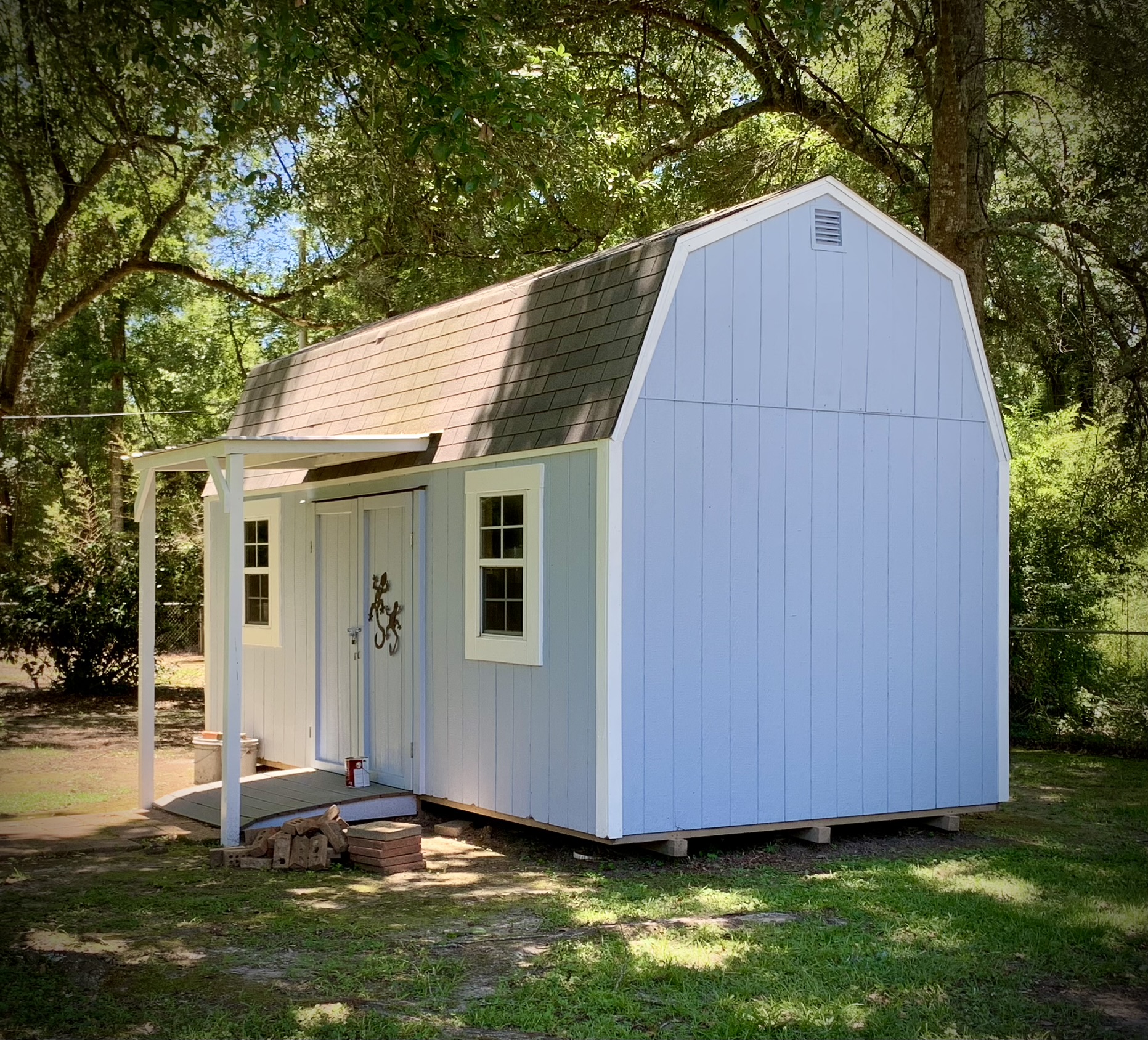 Shed Painted in Kiln MS by local painter Paint Star - blue and white wooden shed freshly painted Sherwin Williams Windy Blue